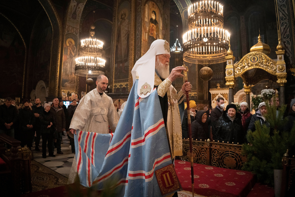 FILE - Patriarch Filaret conducts a service at St. Volodymyr's Cathedralon Orthodox on Orthodox Christmas eve in Kyiv, Ukraine, Friday, Jan. 6, 2023. (AP Photo/Efrem Lukatsky, File)