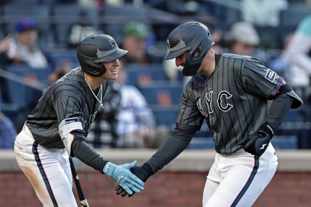 New York Mets' Hayden Senger, right, is congratulated by Carson Benge after hitting his first major league home run during the seventh inning of a baseball game against the Miami Marlins, Saturday, May 30, 2026, in New York. (AP Photo/Adam Hunger)