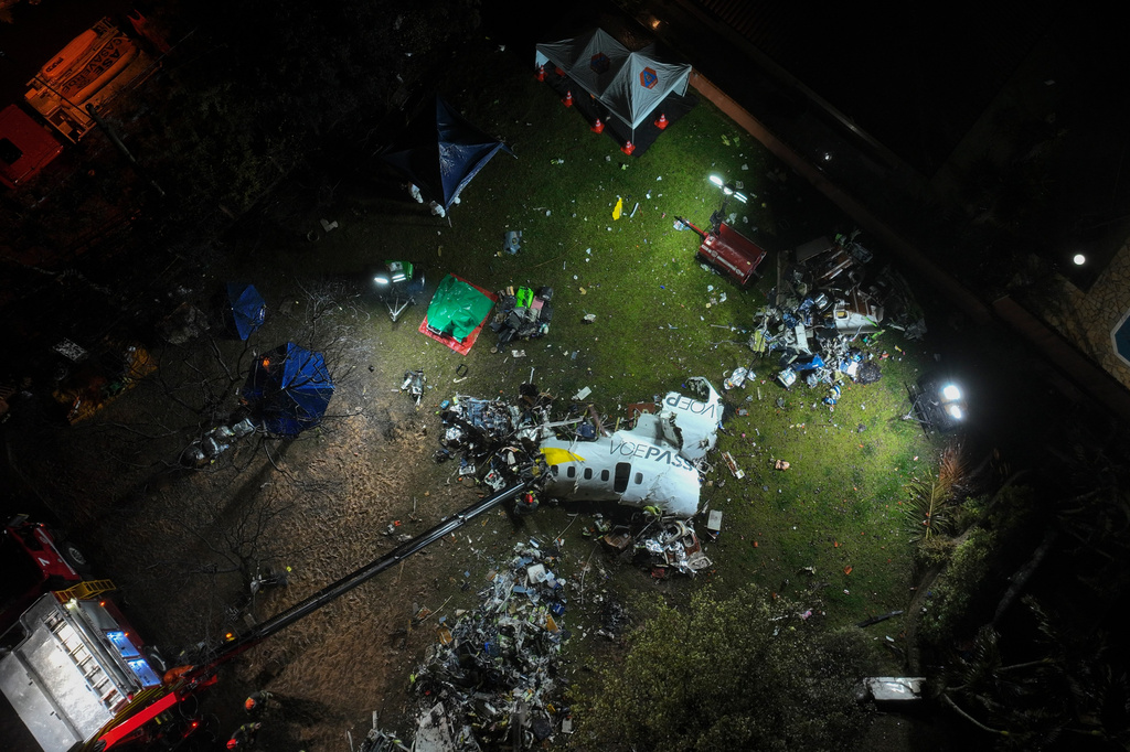 FILE -A view of the debris of a Voepass airplane that crashed the previous day, in Vinhedo, Sao Paulo state, Brazil, Aug. 10, 2024. (AP Photo/Andre Penner, File)