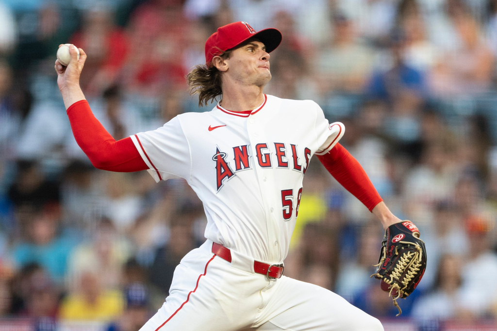 Los Angeles Angels starting pitcher George Klassen works against a Texas Rangers batter in the first inning of a baseball game Wednesday, Aug. 12, 2026, in Anaheim, Calif. (AP Photo/Karl Anderson)