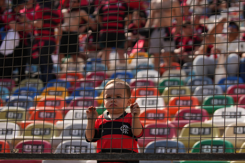 FILE - A young Flamengo fan waits for the start of the Copa Libertadores final soccer match against Brazil's Palmeiras in Lima, Peru, Nov. 29, 2025. Flamengo won the title. (AP Photo/Guadalupe Pardo, File)
