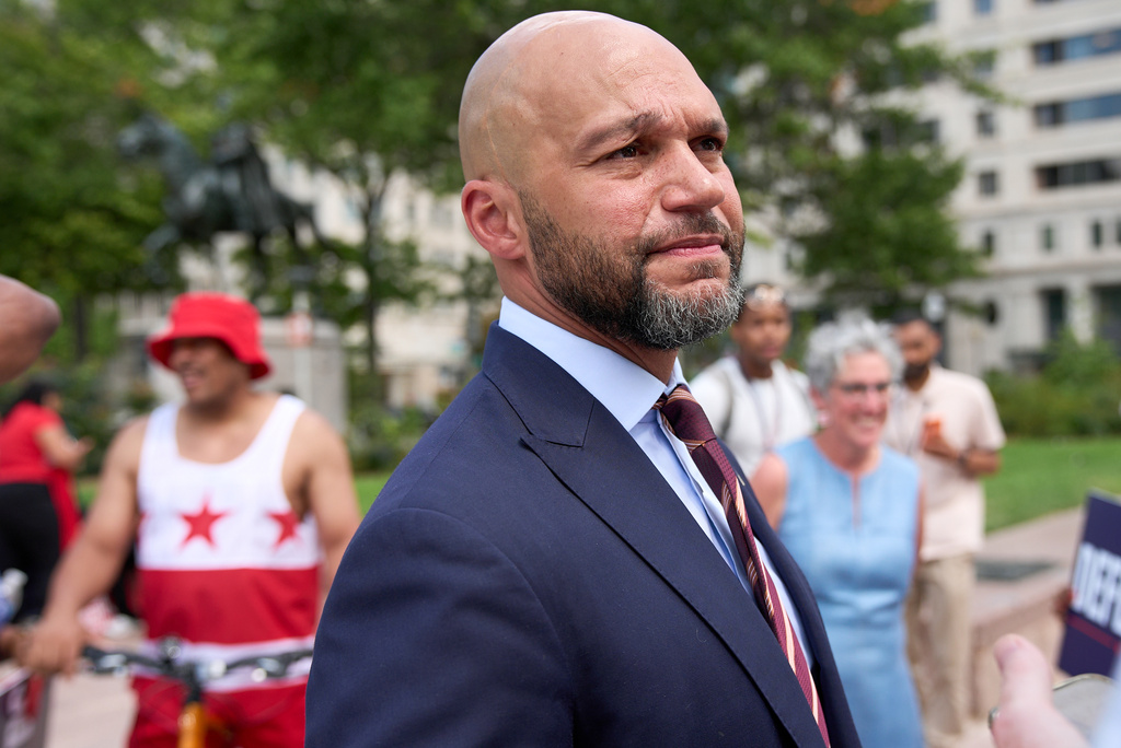 Congressional delegate candidate Robert White greets supporters after attending a news conference at Freedom Plaza in Washington, Monday, Aug. 24, 2026. (AP Photo/Jacquelyn Martin)