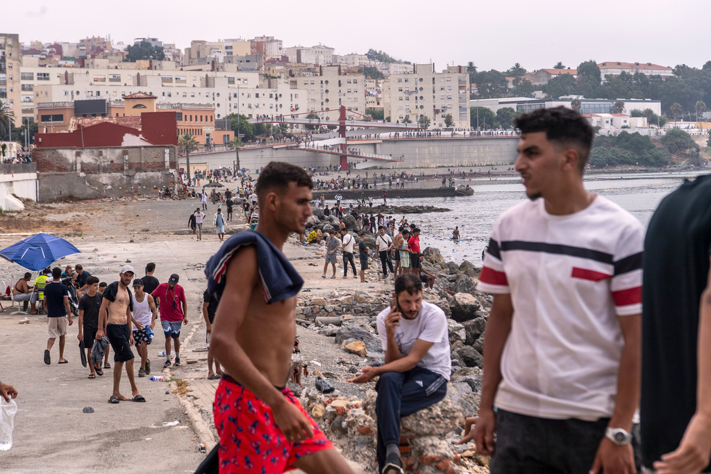 Migrants return to Morocco from the Spanish enclave of Ceuta, Friday, July 31, 2026. (AP Photo/Antonio Sempere)