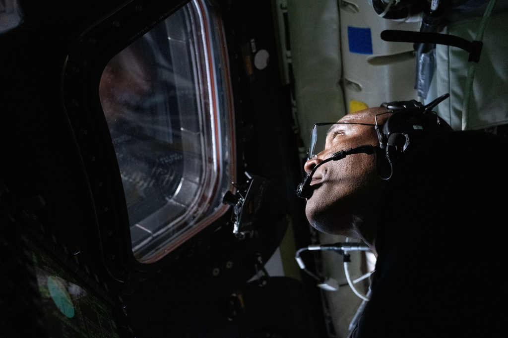 In this image provided by NASA, Artemis II Pilot Victor Glover is photographed in the Orion spacecraft during the Artemis II lunar flyby on Monday, April 6, 2026. (NASA via AP)