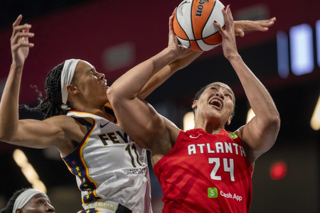 Atlanta Dream forward Brionna Jones (24) attempts a basket against the Indiana Fever during the first half of Game 1 in the first round of the WNBA basketball playoffs Sunday, Sept. 14, 2025, in Atlanta. (AP Photo/Erik Rank)