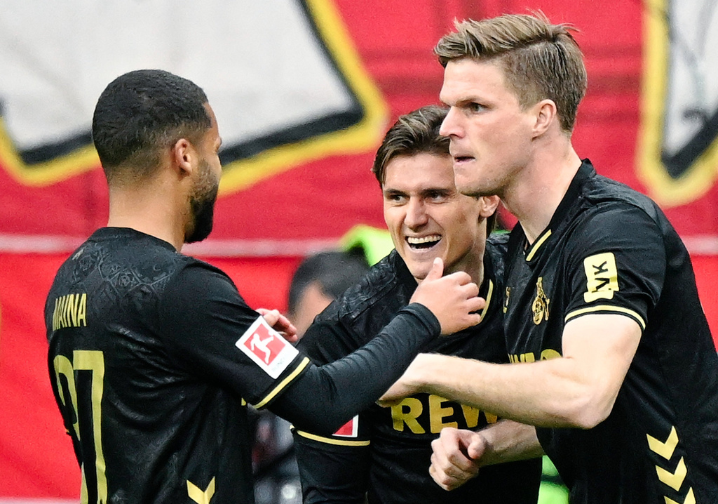 Cologne's Alessio Castro-Montes, center, celebrates with teammates after scoring during the German Bundesliga soccer match between Eintracht Frankfurt and 1. FC Cologne in Frankfurt, Germany, Sunday, April 5, 2026. (Uwe Anspach/dpa via AP)