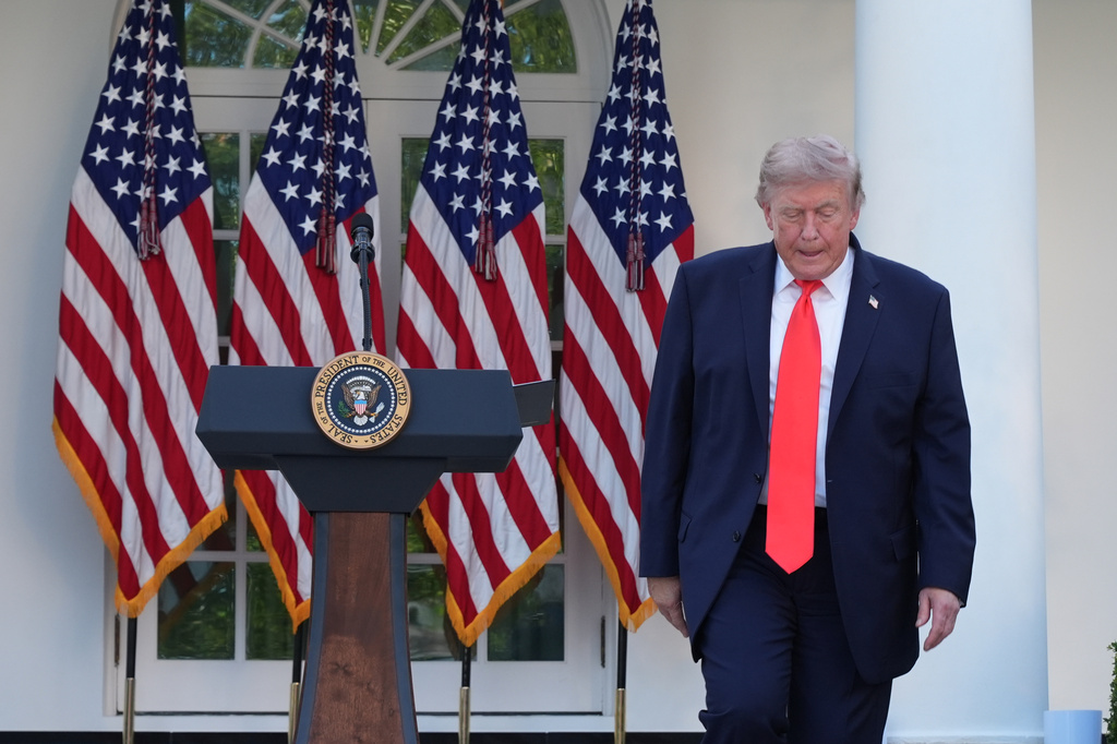 President Donald Trump walks to greet guests after speaking at a Rose Garden Club dinner with farmers, in the Rose Garden of the White House, Thursday, June 25, 2026, in Washington. (AP Photo/Jacquelyn Martin)