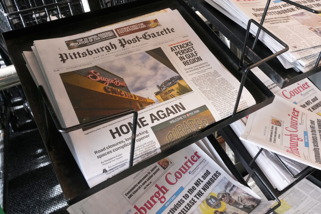 The printed edition of the Pittsburgh Post-Gazette sits in a newspaper rack, Thursday, April 2, 2026, in Pittsburgh. (AP Photo/Gene J. Puskar)