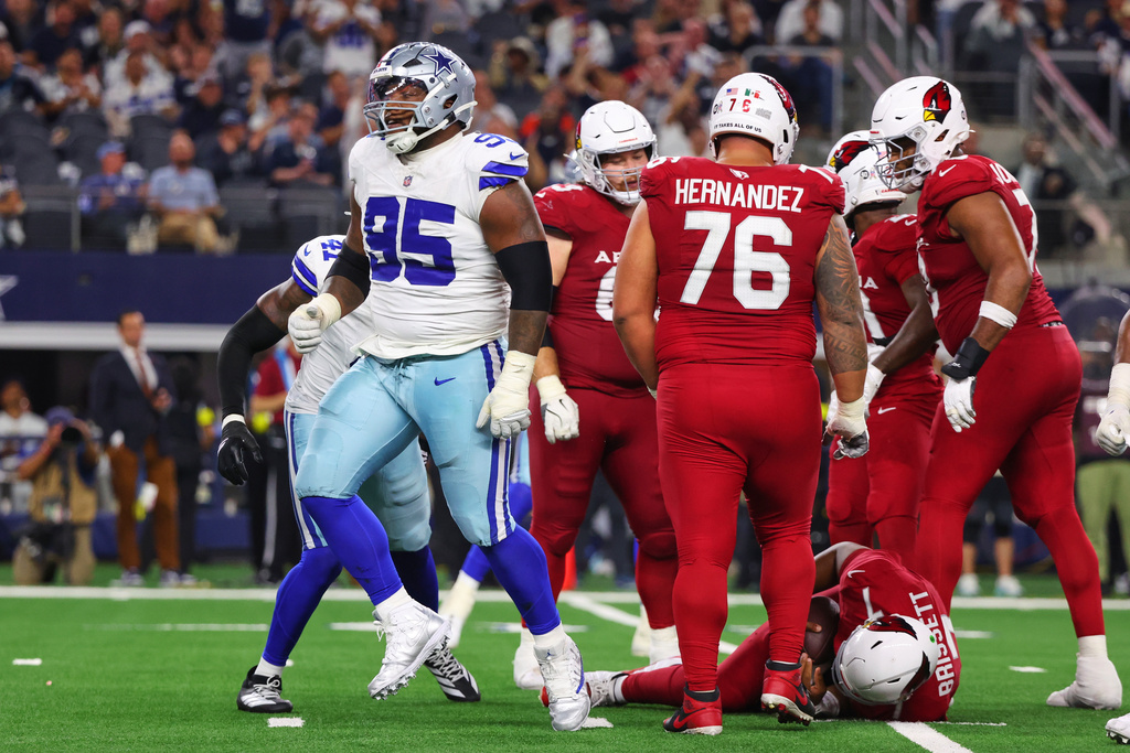 Dallas Cowboys defensive tackle Kenny Clark (95) celebrates after sacking Arizona Cardinals quarterback Jacoby Brissett (7) in the second half of an NFL football game Monday, Nov. 3, 2025, in Arlington, Texas. (AP Photo/Richard Rodriguez)