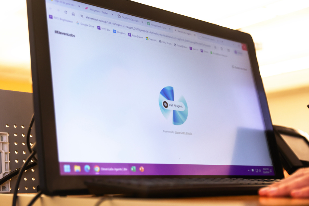 Professor Panos Ipeirotis uses an oral AI agent during his class at NYU Stern School of Business, March 4, 2026, in New York. (AP Photo/Heather Khalifa)