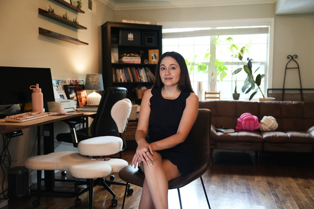 Elsa Sanchez, whose working permit expired because of DACA renewal delays, poses for a photo on Wednesday, April 29, 2026, in Atlanta. (AP Photo/Emilie Megnien)