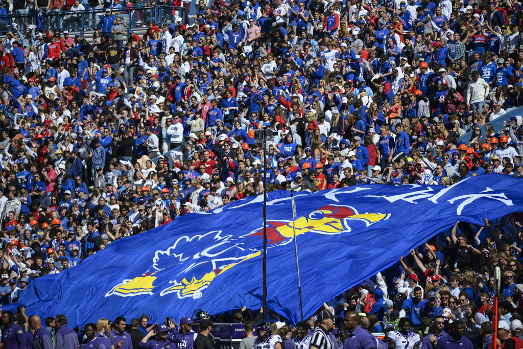 FILE - Kansas fans fill David Booth Kansas Memorial Stadium for the third straight time for an NCAA college football game against TCU, Oct. 8, 2022, in Lawrence, Kan. (AP Photo/Reed Hoffmann, file)