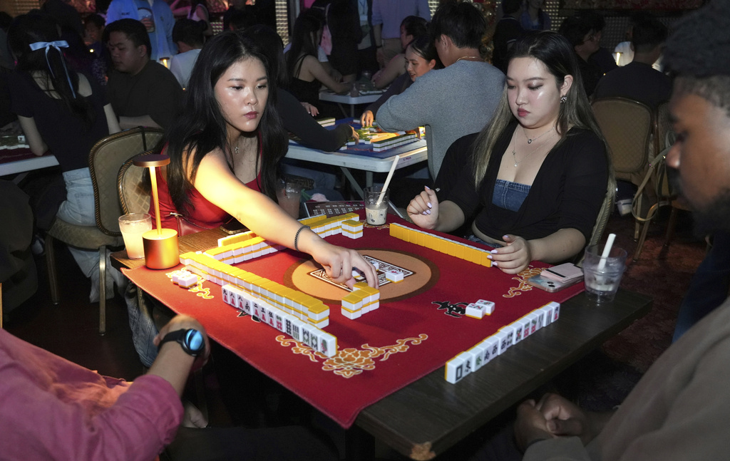 People play mahjong at an event organized by the YLL Mahjong Club on Friday, Aug. 15, 2025, in San Francisco. (AP Photo/Terry Chea)