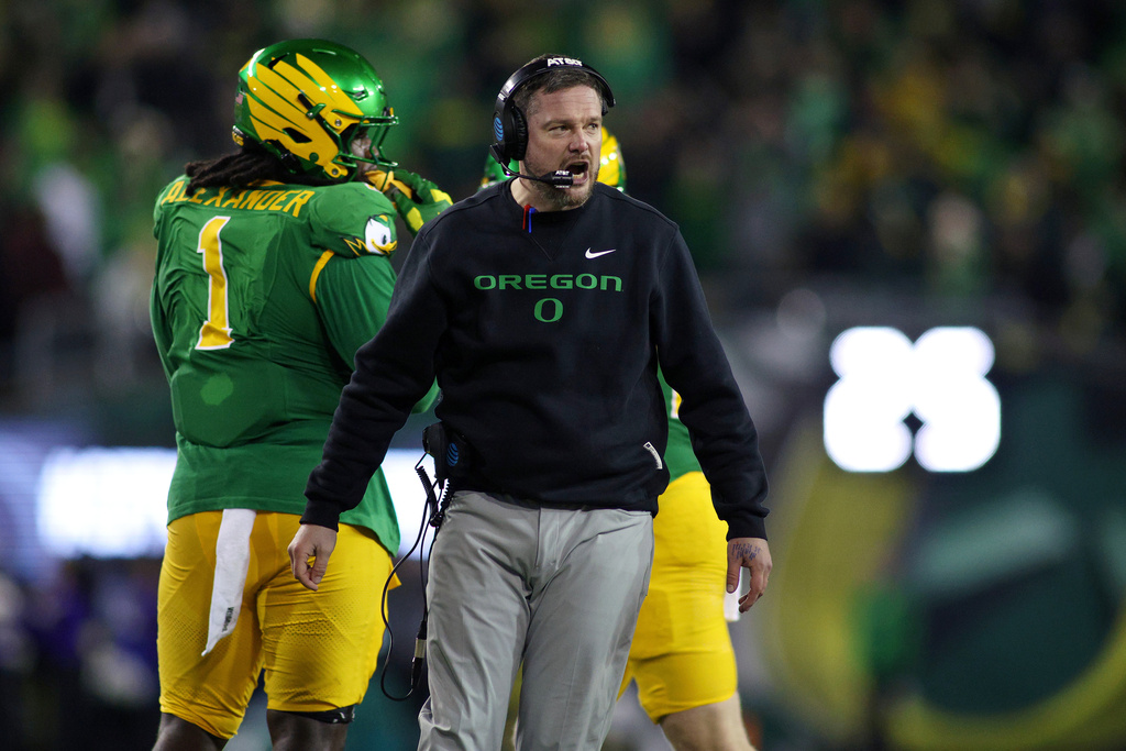 Oregon head coach Dan Lanning calls to his team during the first half of the first round of the NCAA College Football Playoff against James Madison, Saturday, Dec. 20, 2025, in Eugene, Ore. (AP Photo/Lydia Ely)