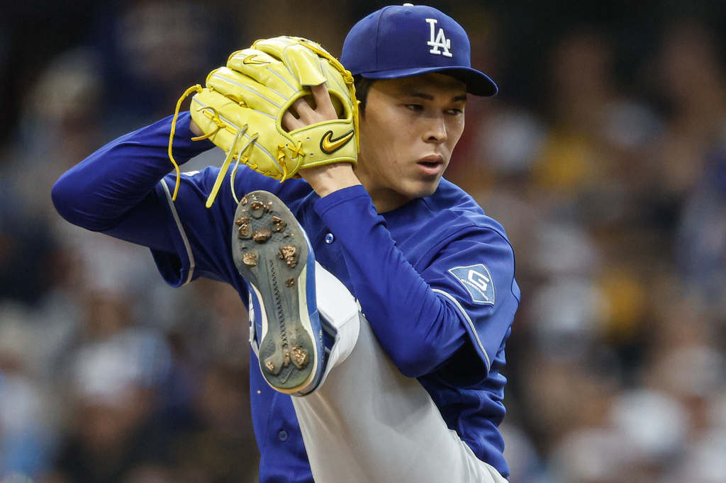 Los Angeles Dodgers pitcher Roki Sasaki throws to the Milwaukee Brewers during the first inning of a baseball game, Saturday, May 23, 2026, in Milwaukee. (AP Photo/Jeffrey Phelps)