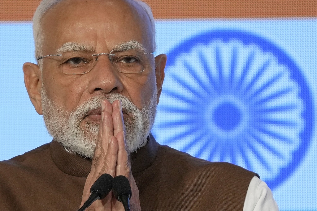 Indian Prime Minister Narendra Modi greets guests during the Japan India Economic Forum in Tokyo Friday, Aug. 29, 2025. (AP Photo/Eugene Hoshiko)