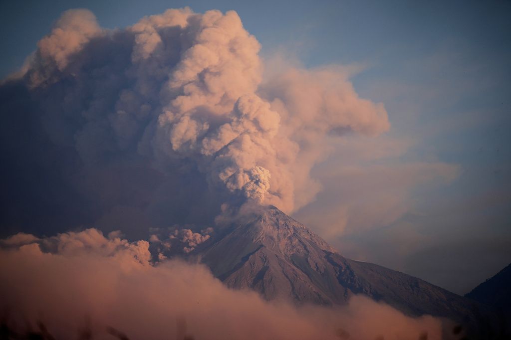 FILE - The "Volcan de Fuego," or Volcano of Fire, blows a cloud of ash seen from Palin, Guatemala, on March 10, 2025. (AP Photo/Moises Castillo, File)
