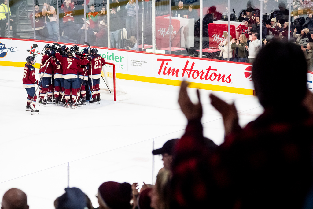 Montreal Victoire goaltender Ann-Renee Desbiens (35) celebrates with teammates after defeating the Seattle Torrent in PWHL hockey game action in Laval, Quebec, Thursday, March 19, 2026. (Christopher Katsarov/The Canadian Press via AP)