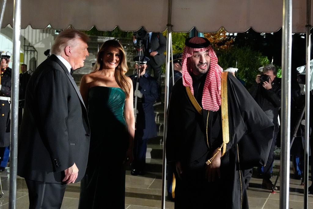President Donald Trump and first lady Melania Trump welcome Saudi Arabia's Crown Prince Mohammed bin Salman for a dinner at the White House, Tuesday, Nov. 18, 2025, in Washington. (AP Photo/Alex Brandon)