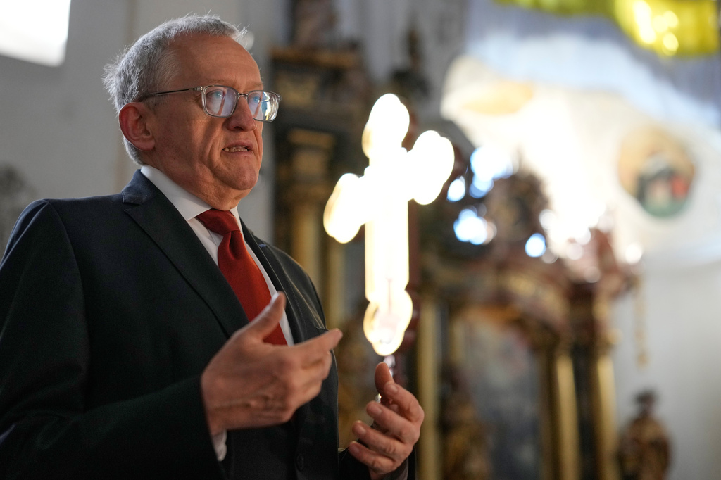 Historian Gunter Dippold gestures as he talks to journalists inside the catholic monastery church of Banz in Bad Staffelstein, Germany, Saturday, May 2, 2026. (AP Photo/Matthias Schrader)