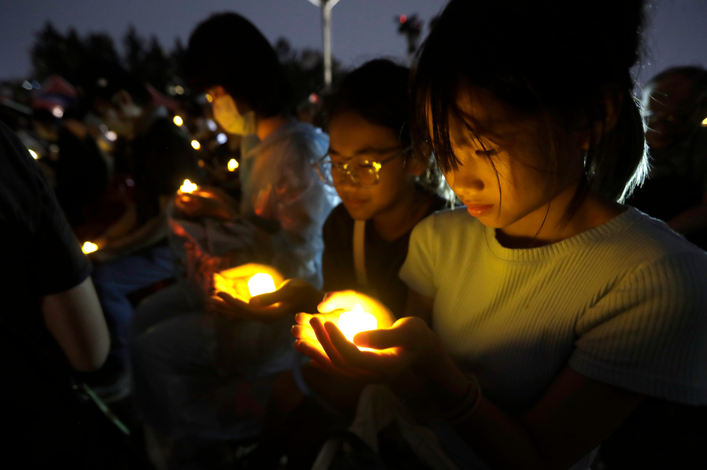 Participants attend a candlelight vigil at Democracy Square to mark the 37th anniversary of the Chinese military crackdown on the pro-democracy movement in Beijing's Tiananmen Square, in Taipei, Taiwan, Thursday, June 4, 2026. (AP Photo/Chiang Ying-ying)