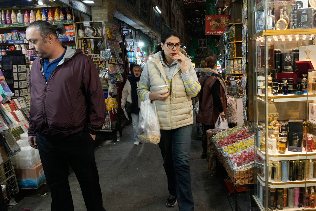 People walk through the Tajrish bazaar market in northern Tehran, Iran, Tuesday, Jan. 27, 2026. (AP Photo/Vahid Salemi)