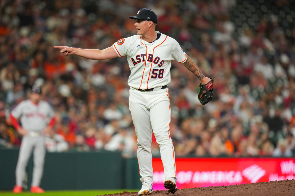 Houston Astros starting pitcher Hunter Brown reacts after striking out Boston Red Sox's Roman Anthony during the third inning of a baseball game in Houston, Tuesday, March 31, 2026. (AP Photo/Jon Shapley)