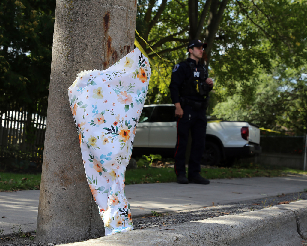 A bouquet of flowers is shown near Son of Jacob Synagogue in Belleville, Ontario on Monday Sept. 21, 2026. (Ian MacAlpine/The Canadian Press via AP)