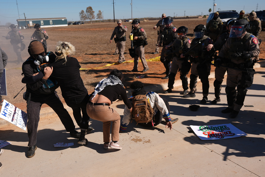 EDS NOTE: OBSCENITY - Texas state troopers advance on protesters, launching pepper spray outside the South Texas Family Residential Center detention facility where Liam Ramos and his father are being detained in Dilley, Texas, Wednesday, Jan. 28, 2026. (AP Photo/Eric Gay)
