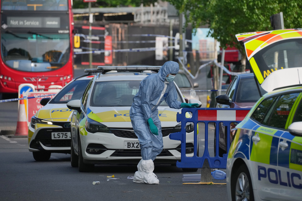 Forensic officers search the area after two people were stabbed in Golders Green neighborhood, that has a large Jewish community, in London, Wednesday, April 29, 2026.(AP Photo/Kin Cheung)