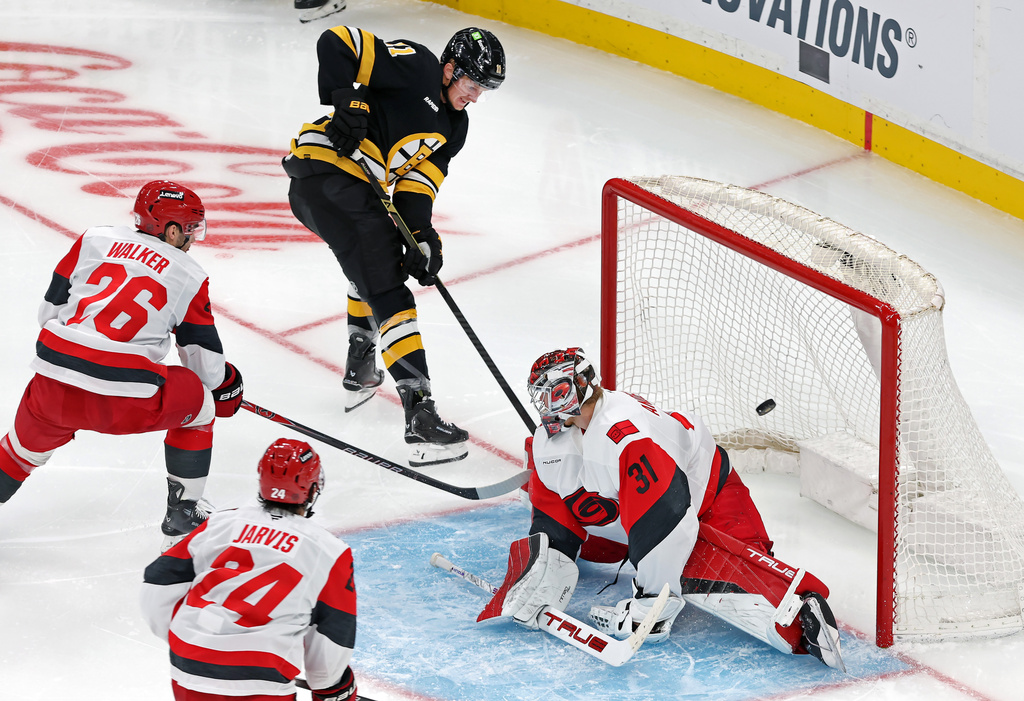 Boston Bruins' forward Casey Mittelstdt scores past Carolina Hurricanes goalie Frederik Andersen during the third period of an NHL hockey game, Saturday, Nov. 1, 2025, in Boston. (AP Photo/Jim Davis)