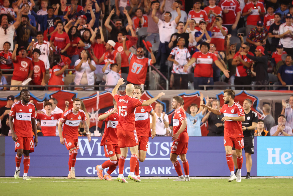 Chicago Fire players celebrate after a second-half goal against Toronto FC during an MLS soccer match Saturday, Oct. 4, 2025, in Chicago. (AP Photo/Talia Sprague)