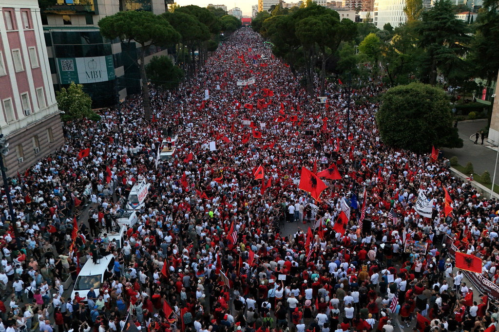 Protesters take part in a rally in Tirana, Saturday, June 20, 2026, against a coastal development project in western Albania linked to Donald Trump's son-in-law Jared Kushner, which is facing growing opposition from environmental advocates and has triggered daily protests in the Albanian capital. (AP Photo/Hameraldi Agolli)