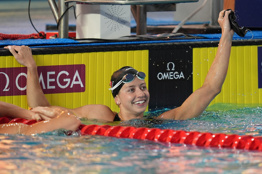 Kate Douglass, of the United States, smiles after winning the women's 50 meters freestyle final with a new world record at the Pan Pacific Swimming Championships Saturday, Aug. 15, 2026 in Irvine, Calif. (AP Photo/Gregory Bull)