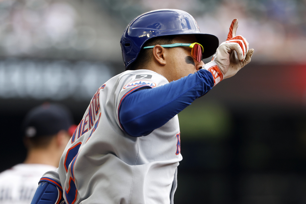New York Mets' Mark Vientos reacts after hitting a two run home run during the second inning of a baseball game, Sunday, Aug. 24, 2025, in Atlanta. (AP Photo/Butch Dill)