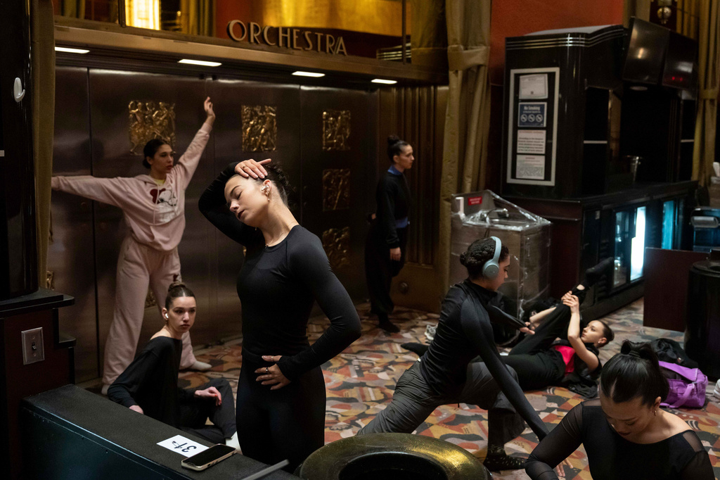 Dancers warm up and stretch before an audition for the Radio City Rockettes at Radio City Music Hall in New York, on Wednesday, April 22, 2026. (AP Photo/Yuki Iwamura)
