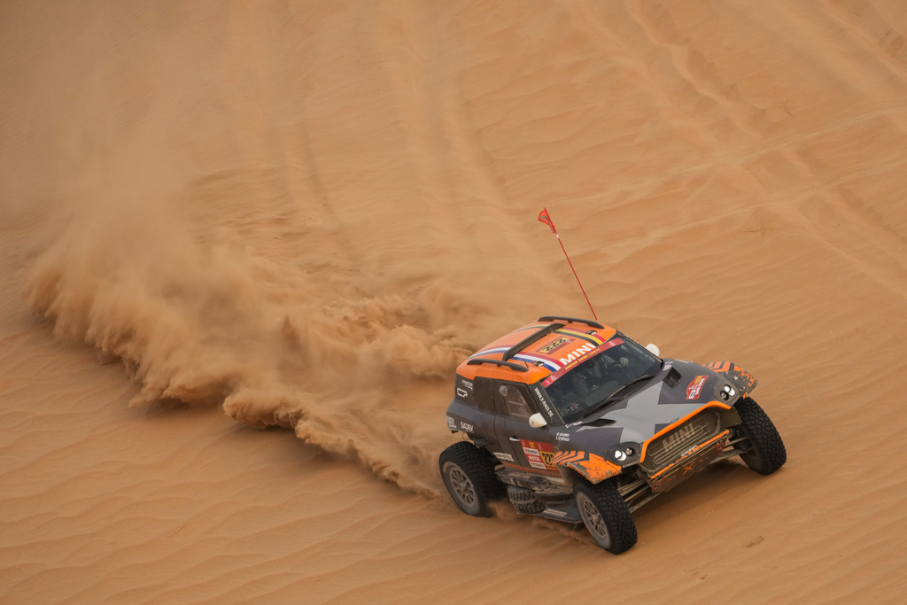 Driver Guillaume de Mevius and co-driver Mathieu Baumel compete during the tenth stage of the Dakar Rally between Wadi Ad Dawasir and Bisha, Saudi Arabia, Wednesday, Jan.14, 2026. (AP Photo/Thibault Camus)