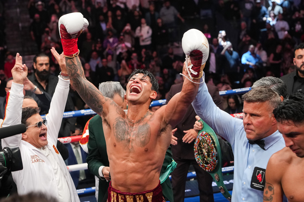 Ryan Garcia celebrates after winning in a WBC welterweight title boxing match against Mario Barrios Saturday, Feb. 21, 2026, in Las Vegas. (AP Photo/Lucas Peltier)