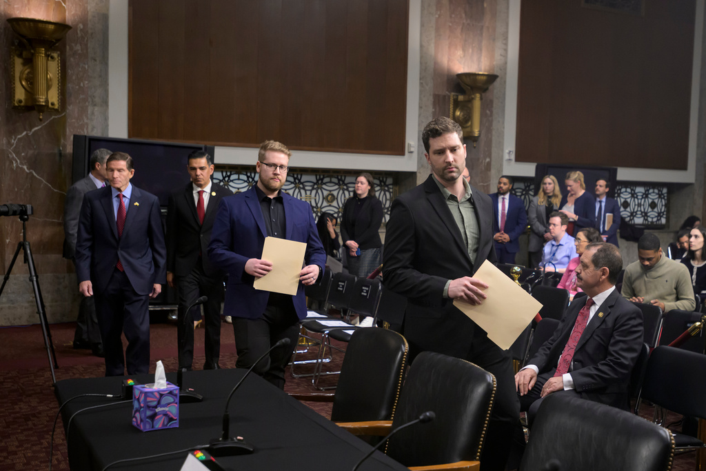 Sen. Richard Blumenthal, D-Conn., left, Rep. Robert Garcia, D-Calif., second from left, Luke Ganger, second from right, and Brent Ganger, right, brothers of Renee Good, arrive during a Bicameral Public Forum on the Disproportionate Use of Force by DHS Agents, on Capitol Hill, Tuesday, Feb. 3, 2026, in Washington. (AP Photo/Rod Lamkey, Jr.)