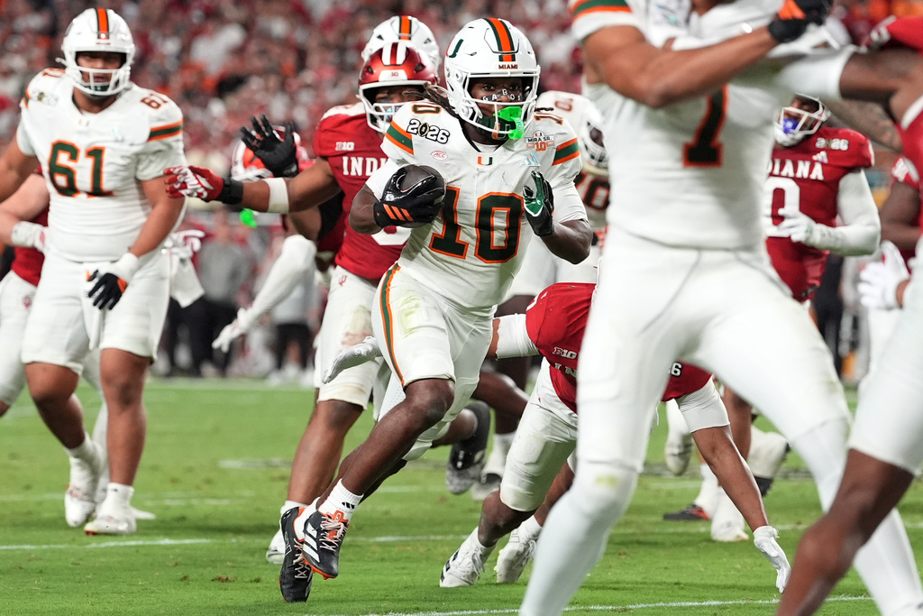 Miami wide receiver Malachi Toney scores against Indiana during the second half of the College Football Playoff national championship game, Monday, Jan. 19, 2026, in Miami Gardens, Fla. (AP Photo/Rebecca Blackwell)