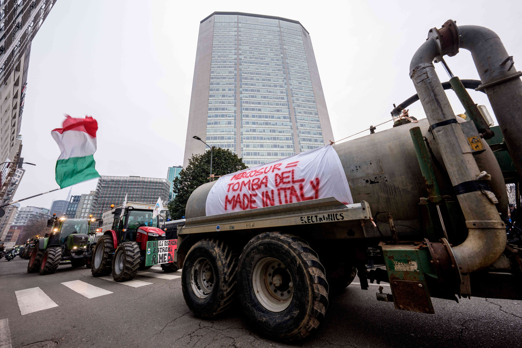 A banner with writing in Italian "Mercusur, the tomb of made in Italy" hangs from a truck during a farmers protest against the Mercosur deal, a free trade deal between the European Union and five South American nations, in Milan, Italy, Friday, Jan. 9, 2026. (Claudio Furlan/LaPresse via AP)