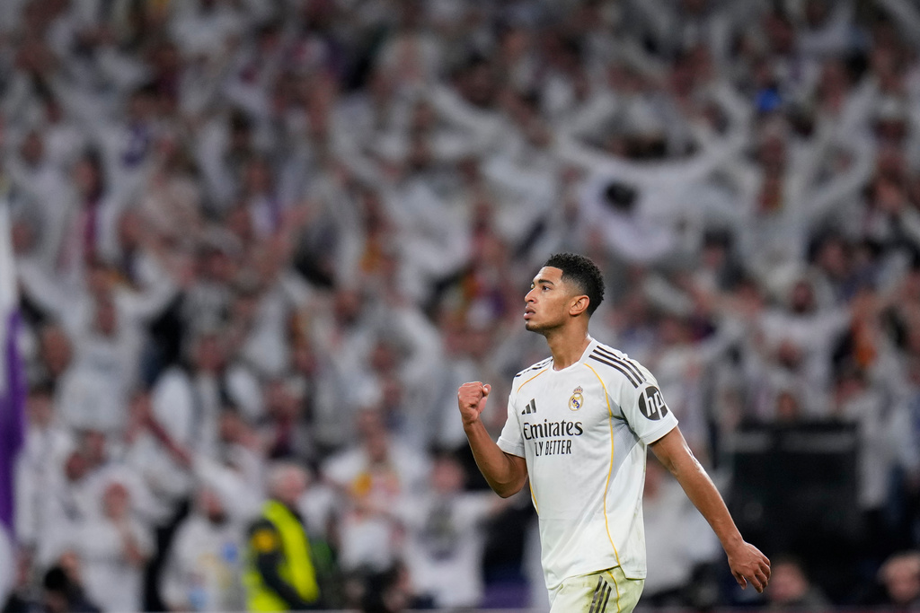 Real Madrid's Jude Bellingham, celebrates after scoring the opening goal during the Spanish La Liga soccer match between Real Madrid and Sevilla in Madrid, Spain, Saturday, Dec. 20, 2025. (AP Photo/Manu Fernandez)