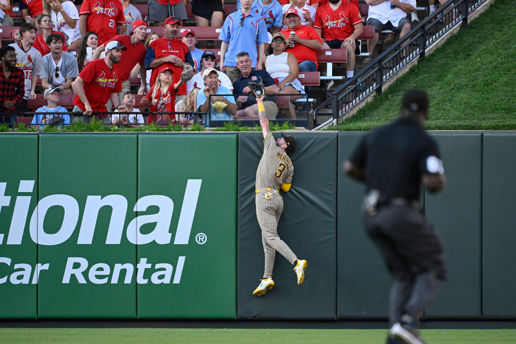 San Diego Padres center fielder Jackson Merrill jumps at the wall and catches a fly ball hit by St. Louis Cardinals' Alec Burleson in the fourth inning of a baseball game, Monday, June 15, 2026, in St. Louis. (AP Photo/Joe Puetz)