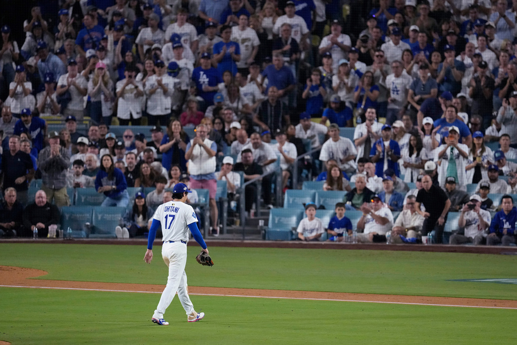 Los Angeles Dodgers' Shohei Ohtani leaves the game during the seventh inning in Game 4 of baseball's World Series against the Toronto Blue Jays, Tuesday, Oct. 28, 2025, in Los Angeles. (AP Photo/David J. Phillip)