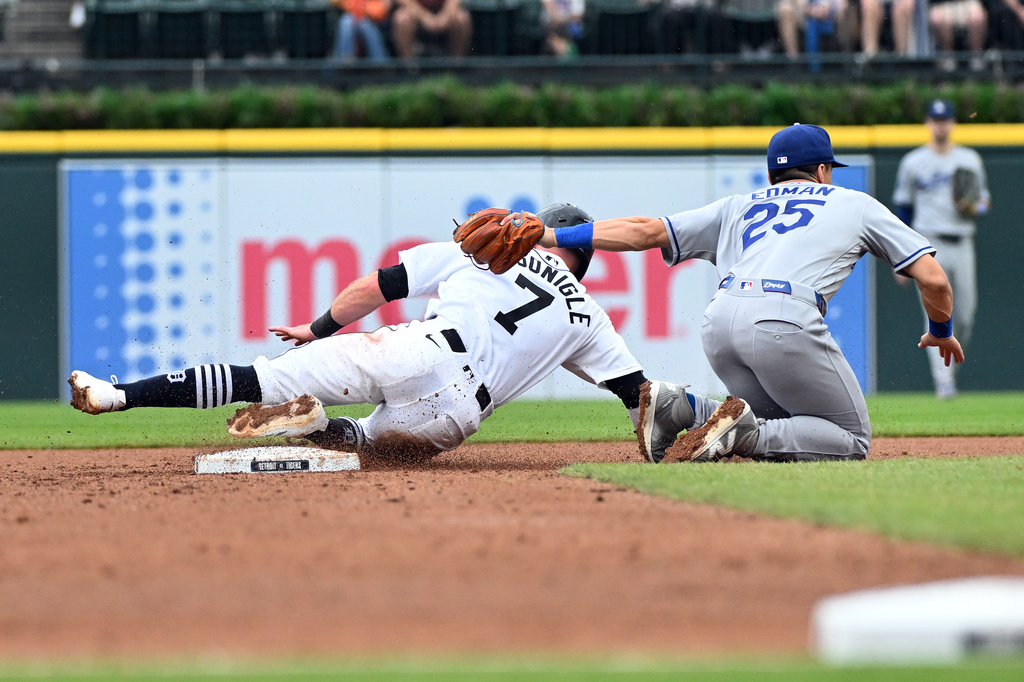 Detroit Tigers' Kevin McGonigle, left, is tagged out trying to steal second base by Los Angeles Dodgers second baseman Tommy Edman during the fourth inning of a baseball game, Sunday, Aug. 30, 2026, in Detroit. (AP Photo/Jose Juarez)
