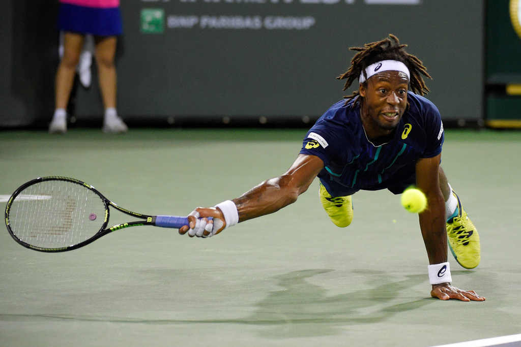 FILE - Gael Monfils, of France, dives as he returns a shot to Milos Raonic, of Canada, at the BNP Paribas Open tennis tournament, Thursday, March 17, 2016, in Indian Wells, Calif. Raonic won 7-5, 6-3. (AP Photo/Mark J. Terrill, File)