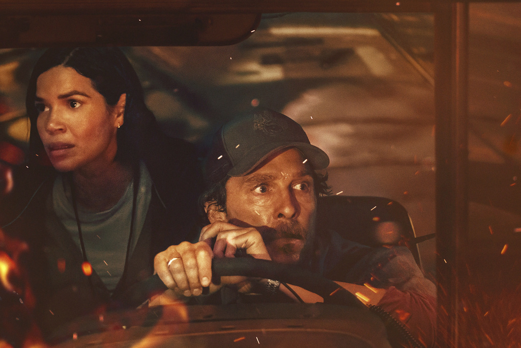 This image released by Apple TV+ shows America Ferrara, left, and Matthew McConaughey in a scene from "The Lost Bus." (Apple TV+ via AP)