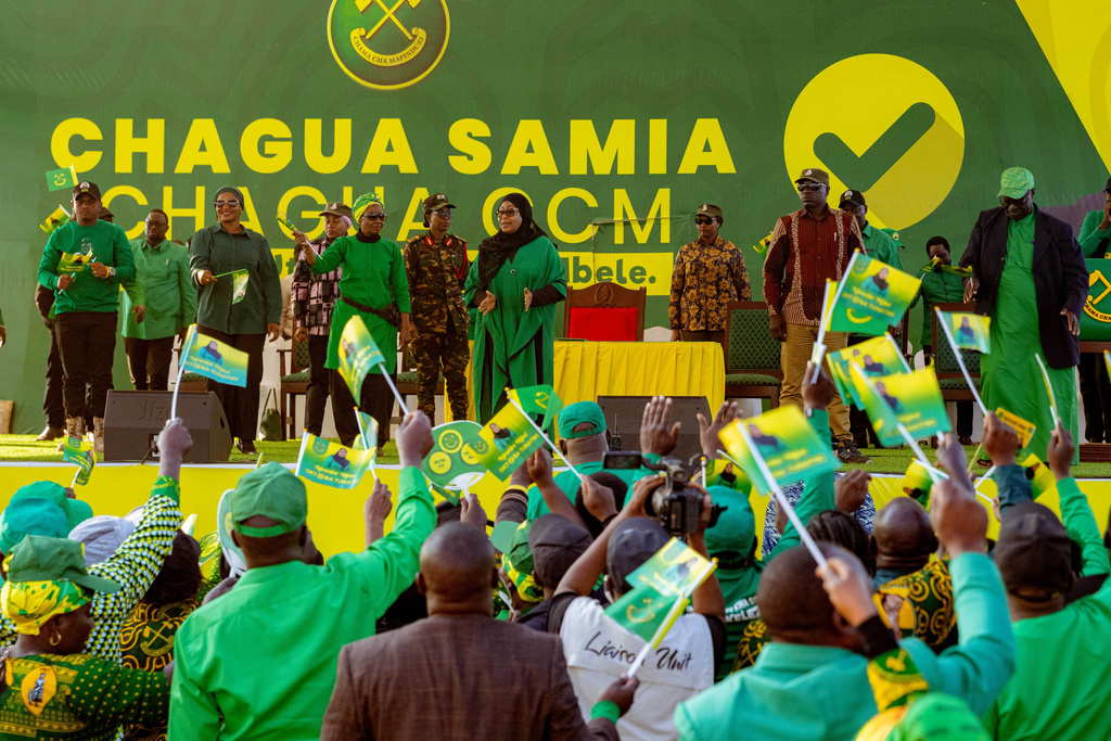 Tanzanian President Samia Suluhu Hassan dance during a campaign rally ahead of the general elections in Iringa, Tanzania, Sunday, Oct. 5, 2025. (AP Photo)