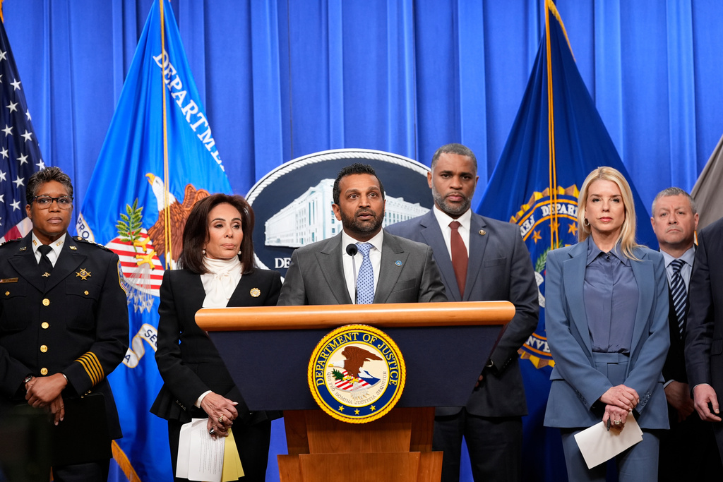 FBI Director Kash Patel speaks at the podium during a news conference at the Department of Justice, Thursday, Dec. 4, 2025, in Washington. Looking on from left is Washington Metropolitan Police Chief Pamela Smith, U.S. Attorney Jeanine Pirro, ATF Special Agent in Charge Anthony Spotswood, Attorney General Pam Bondi, and Assistant Director in Charge of the FBI Washington Field Office Darren Cox. (AP Photo/Alex Brandon)