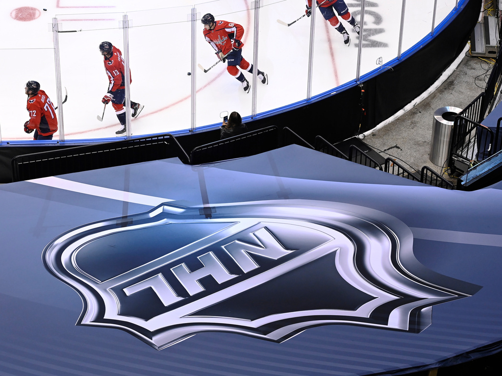 FILE - An NHL logo is displayed on Aug. 14, 2020, prior to the NHL Eastern Conference Stanley Cup playoff hockey game in Toronto. (Nathan Denette/The Canadian Press via AP, File)